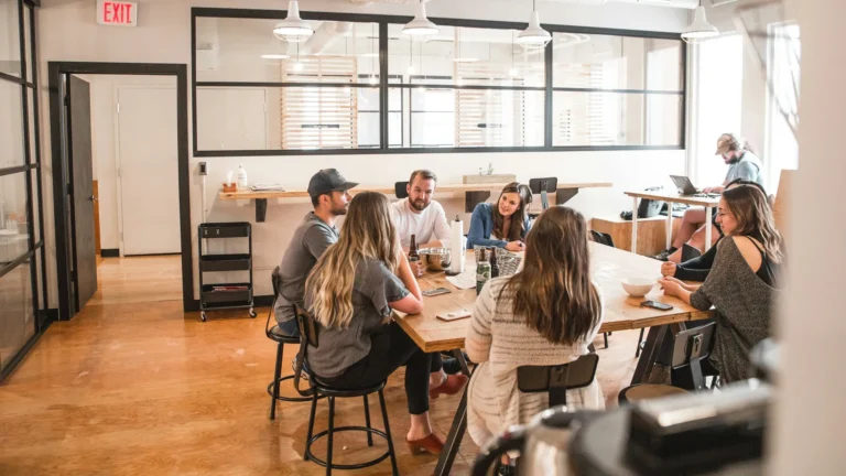 Startup team meeting around a table in a bright office